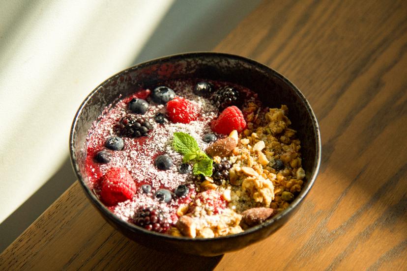 An energizing mix of fresh berries, seasonal fruits, yogurt, and chia seeds, drizzled with honey topped with mixed nuts, granola, and shredded coconut.