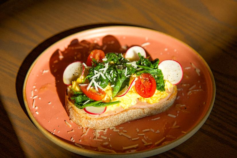 Choice of scrambled or poached eggs on buttered sourdough toast, ham, cheddar cheese, spinach, homemade pickled veggies.