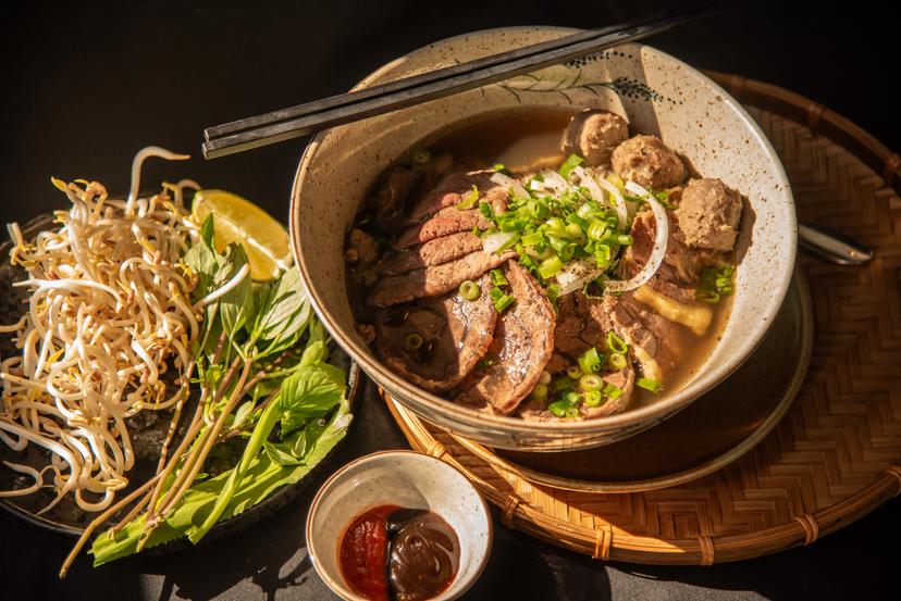 Regular Phở with thinly sliced rare beef and various cuts of beef in a fragrant broth served with fresh herbs, bean sprouts, and lime. Special Phở + beef shank and beef balls - larger size! 