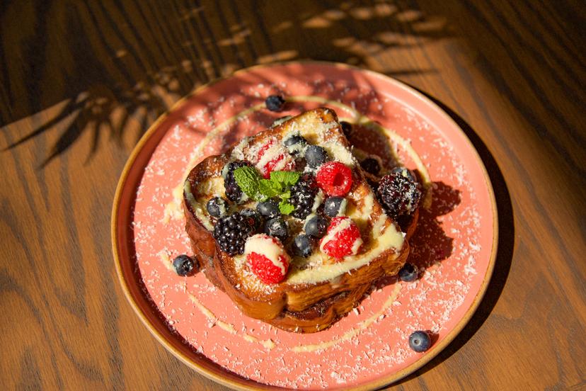 French toast served with homemade anglaise sauce, fresh fruits, and vanilla ice cream.